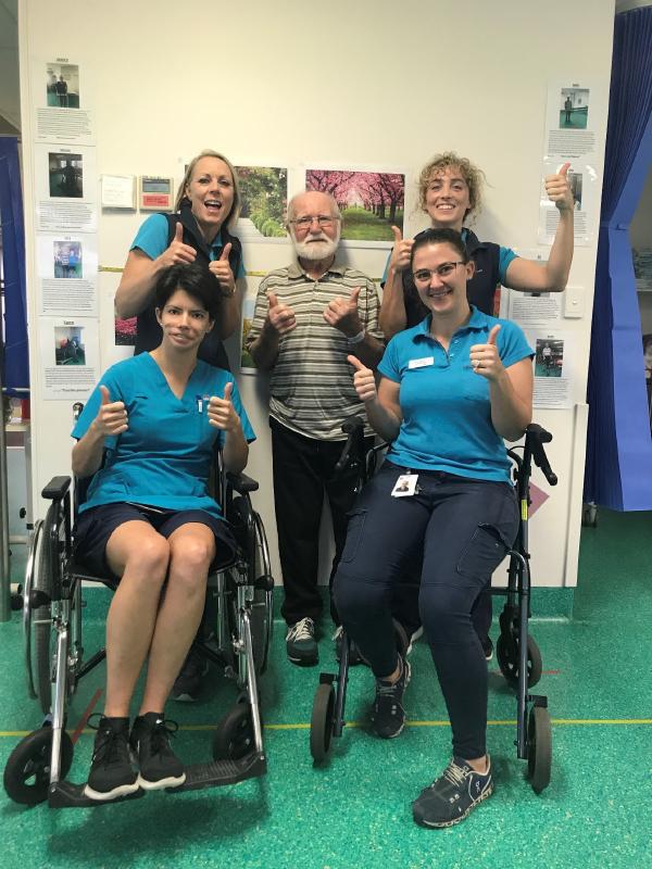 Ray and the Coledale rehab team giving a thumbs up sign